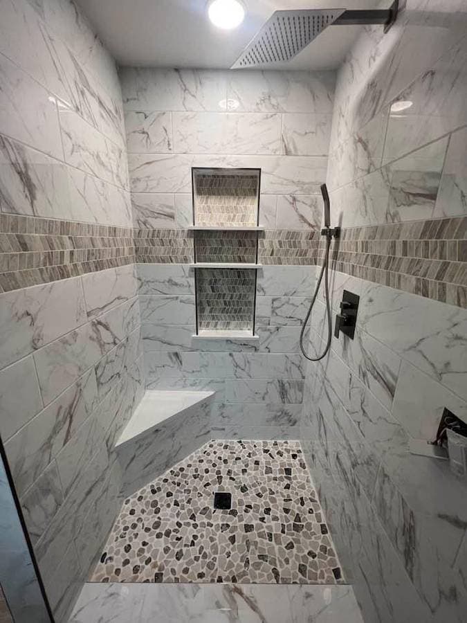 picture of a newly remodeled and tiled bathroom with custom and textured tile