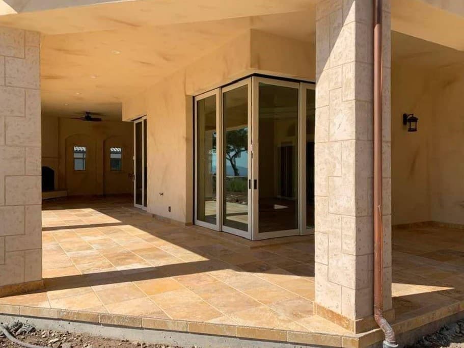 picture of a newly remodeled deck with custom tiling and pavers beige