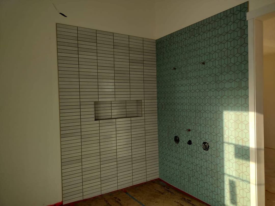 luxury bathroom with custom tiling and different textured bathroom walls
