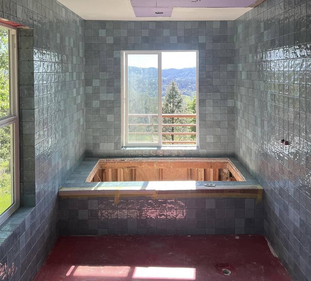 picture of a bathroom ready to be finished, with beautiful tile and backsplash